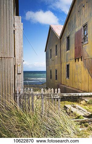 Weathered wooden buildings along the Strait of Magellan; Santa Cruz province, Argentina View Large Photo Image Stock Image - Weathered wooden buildings along the Strait of Magellan; Santa Cruz province, Argentina. Fotosearch