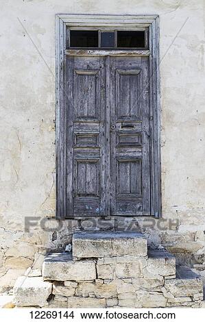 Weathered wooden door with stone slab steps; Arsos, Limassol, Cyprus View Large Photo Image Picture - Weathered wooden door with stone slab steps; Arsos, Limassol, Cyprus. Fotosearch