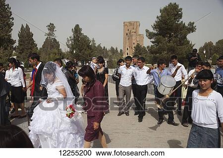 Stock Image - Wedding group in palace gardens, Ak Sarai palace; Shakhrisabz, Uzbekistan. Fotosearch