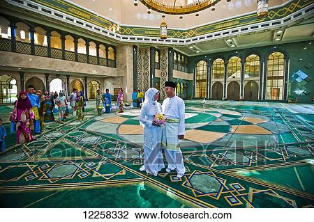 Stock Image - Wedding inside Jame'Asr Hassanil Bolkiah Mosque; Bandar Seri Begawan, Brunei. Fotosearch