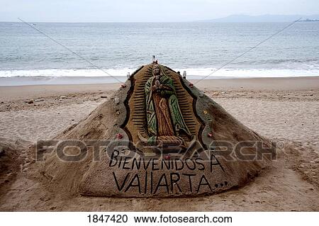 Stock Image - Welcome Sign Made From Sand On Beach; Puerto Vallarta, Mexico. Fotosearch