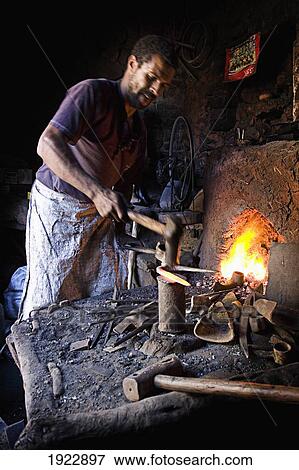 Welder Working In Village In Atlas Mountains, Morocco View Large Photo Image Stock Photo - Welder Working In Village In Atlas Mountains, Morocco. Fotosearch