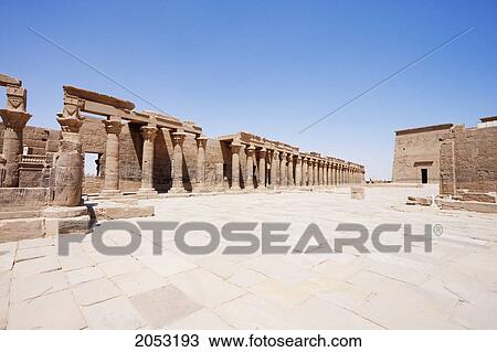 Stock Image - Western Colonnade, First Pylon And Eastern Colonnade Of The Temple Of Isis, Philae, Aswan, Egypt. Fotosearch