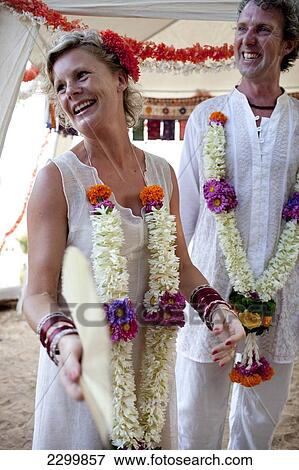 Western couple have a spiritual wedding ceremony at Harmonic Healing Centre, Patnum, Goa, India. View Large Photo Image Stock Photo - Western couple have a spiritual wedding ceremony at Harmonic Healing Centre, Patnum, Goa, India.. Fotosearch