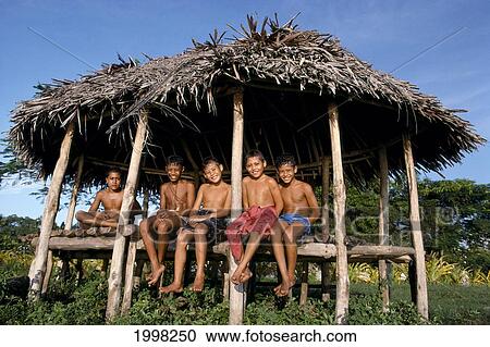 Stock Image - Western Samoa, Children In Fale Open House B1699. Fotosearch
