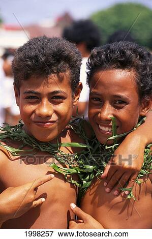 Western Samoa, Two Young Boys Smile And Give Friendly Hand Signs B1697 View Large Photo Image Stock Photo - Western Samoa, Two Young Boys Smile And Give Friendly Hand Signs B1697. Fotosearch