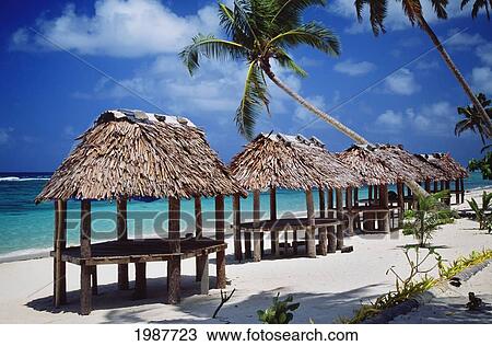 Stock Image - Western Samoa, View Of Samoan Huts On White Sandy Beach. Fotosearch