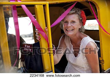 Western tourist bride in a rickshaw taxi, Patnum, Goa, India. View Large Photo Image Stock Photo - Western tourist bride in a rickshaw taxi, Patnum, Goa, India.. Fotosearch