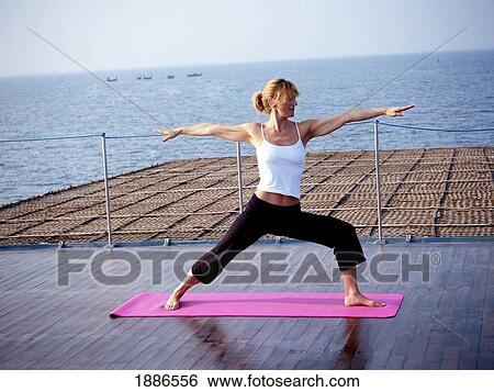 Western Woman Doing Yoga On A Cruise Boat View Large Photo Image Stock Photograph - Western Woman Doing Yoga On A Cruise Boat. Fotosearch