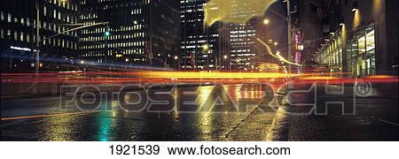 Stock Photo - Wet Sidewalks And Traffic On 6Th Avenue. Fotosearch