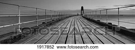 Stock Image - Whitby Pier At Dawn. Fotosearch