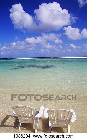 White Beach Chairs On Beautiful Beach, Clear Turquoise Water. View Large Photo Image Picture - White Beach Chairs On Beautiful Beach, Clear Turquoise Water.. Fotosearch