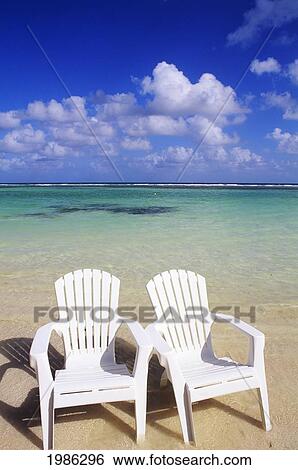 White Beach Chairs On Beautiful Beach, Clear Turquoise Water. View Large Photo Image Stock Photograph - White Beach Chairs On Beautiful Beach, Clear Turquoise Water.. Fotosearch