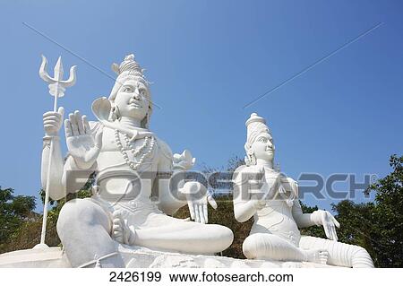 Stock Photo - White buddhist statues; Visakhapatnam, Andhra Pradesh, India. Fotosearch