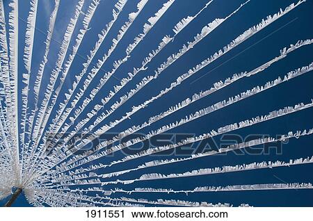 Stock Image - White Bunting Hanging From Pole, Caimari, Majorca, Balearic Islands, Spain. Fotosearch