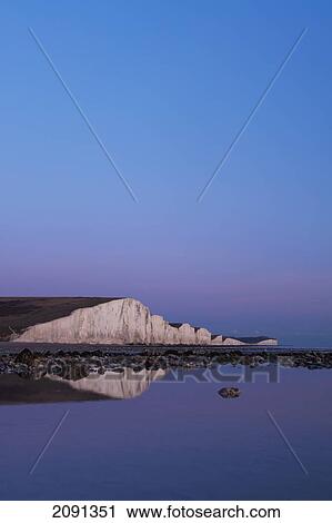 Stock Image - White Cliffs Of The Seven Sisters National Park At Dusk, East Sussex, Uk. Fotosearch