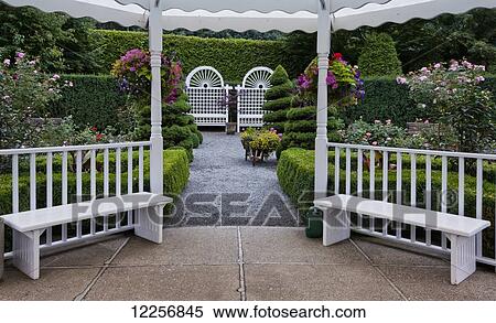 White gazebo with hanging flower baskets in Minter Gardens; Rosedale, British Columbia, Canada View Large Photo Image Stock Photography - White gazebo with hanging flower baskets in Minter Gardens; Rosedale, British Columbia, Canada. Fotosearch