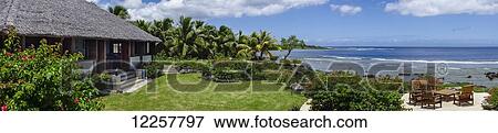 Stock Photo - White Grass Ocean Resort bungalows; Tanna Island, Vanuatu. Fotosearch