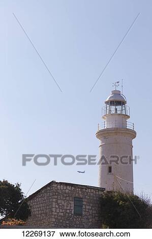 White lighthouse against a blue sky; Paphos, Cyprus View Large Photo Image Stock Photo - White lighthouse against a blue sky; Paphos, Cyprus. Fotosearch