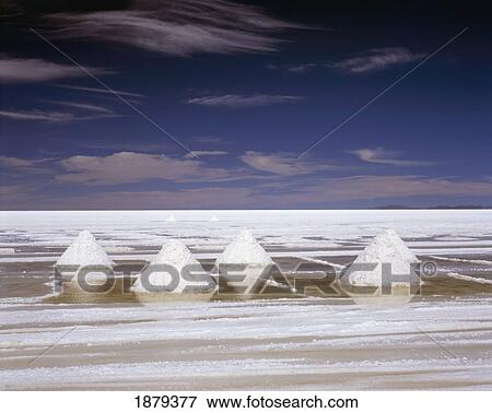Stock Photo - White Piles Of Salt In Stark Landscape. Fotosearch