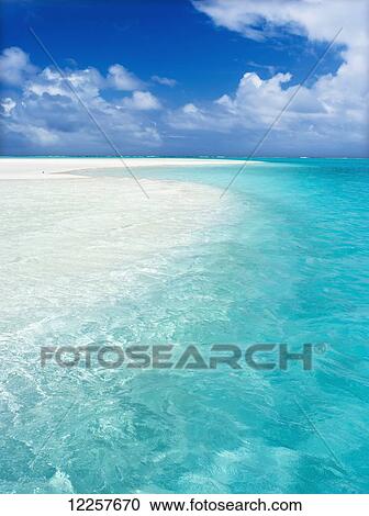 Stock Image - White sand beach and turquoise water; Barefoot Island, Aitutaki, Cook Islands. Fotosearch
