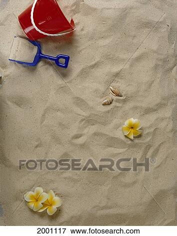 White Sand With Bucket And Shovel, Shells And Several Plumeria Flowers View Large Photo Image Stock Photo - White Sand With Bucket And Shovel, Shells And Several Plumeria Flowers. Fotosearch
