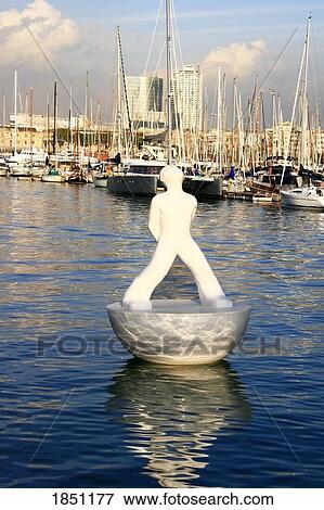 Stock Photo - White Statue Floating Near Busy Marina. Fotosearch