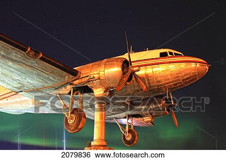 Whitehorse's Large Dc-3 Wind Vane With Aurora Borealis (Northern Lights) Behind It. View Large Photo Image Stock Photograph - Whitehorse's Large Dc-3 Wind Vane With Aurora Borealis (Northern Lights) Behind It.. Fotosearch