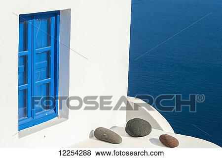 Whitewash building with blue trimmed window along the Aegean sea; Oia, Santorini, Greece View Large Photo Image Stock Photo - Whitewash building with blue trimmed window along the Aegean sea; Oia, Santorini, Greece. Fotosearch
