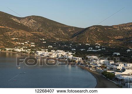 Stock Photo - Whitewash buildings along the water; Platis Ghialos, Sifnos, Cyclades, Greek Islands, Greece. Fotosearch