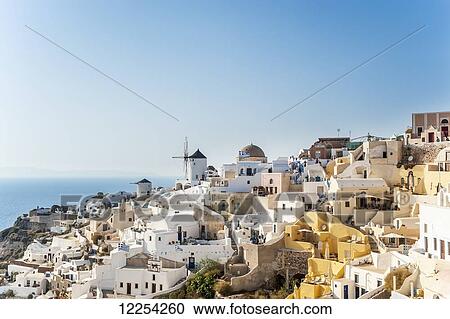 Stock Image - Whitewash buildings on a hillside; Oia, Santorini, Greece. Fotosearch