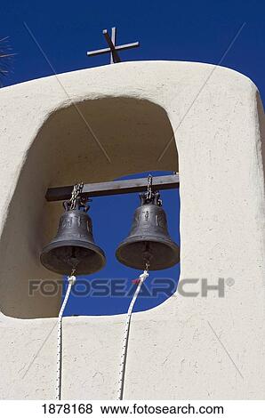 Stock Photo - Whitewashed Bell Tower And Blue Sky, Close Up. Fotosearch
