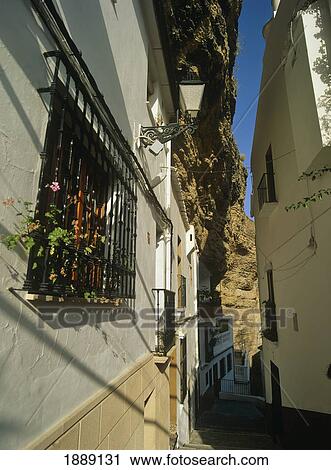 Stock Image - Whitewashed Buildings And Alleyway. Fotosearch