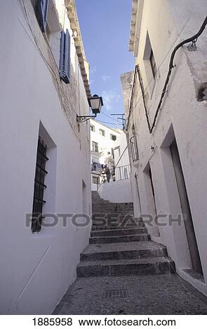 Stock Photo - Whitewashed Buildings And Narrow Alleyway. Fotosearch