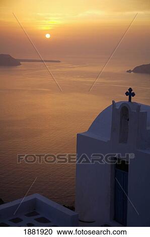 Stock Image - Whitewashed Chapel By Sea At Sunset. Fotosearch