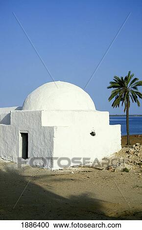 Stock Image - Whitewashed Guellala Mosque Along The Coast. Fotosearch