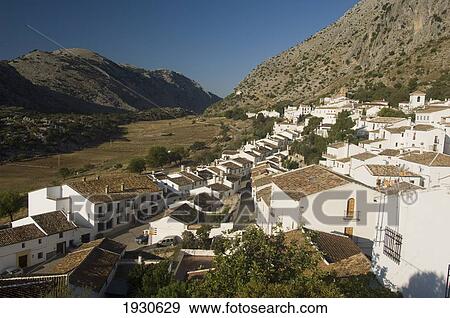 Stock Photo - Whitewashed Village In Mountains; Parque Natural De La Sierra, Villaluenga Del Rosario, Spain. Fotosearch