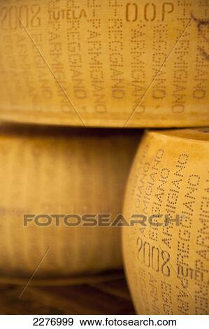 Stock Photo - Whole parmesan cheeses for sale in Kaaskamer cheese shop, Amsterdam, Holland.. Fotosearch