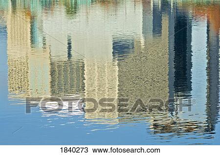 Stock Image - Willamette River, Portland, Oregon, Usa; Reflection Of Buildings In A River. Fotosearch