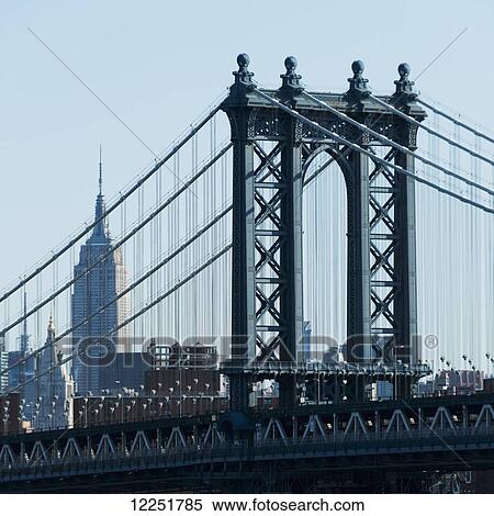 Stock Photography - Williamsburg Bridge and Empire State Building; New York City, New York, United States of America. Fotosearch