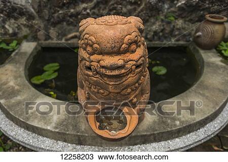 Stock Image - Wind Lyon, from China, to wish protection against the constant wind; Shuitou, Kinsmen Island, Taiwan. Fotosearch