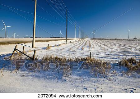 Wind Turbines And Hydro Lines Along Rural Road In Winter, Dufferin County, Ontario View Large Photo Image Picture - Wind Turbines And Hydro Lines Along Rural Road In Winter, Dufferin County, Ontario. Fotosearch