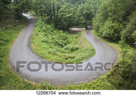 Winding road through the Alpuan Alps; Lucca Garfagnana, Tuscany, Italy View Large Photo Image Picture - Winding road through the Alpuan Alps; Lucca Garfagnana, Tuscany, Italy. Fotosearch