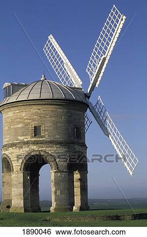Stock Photograph - Windmill In Green Fields. Fotosearch
