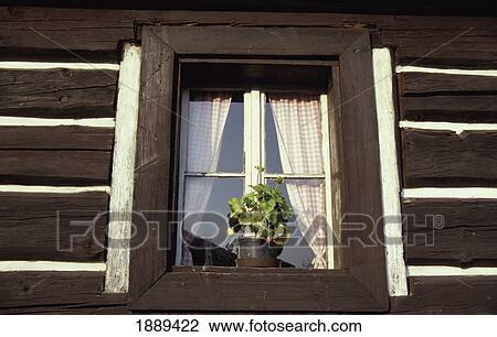 Stock Image - Window Of A Traditional Wooden Cottage, Tuzina, Slovakia.. Fotosearch
