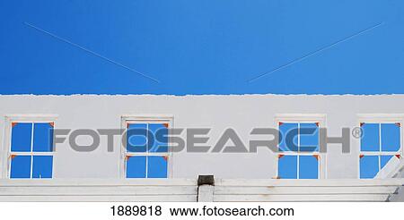 Windows Against Blue Sky View Large Photo Image Stock Photo - Windows Against Blue Sky. Fotosearch
