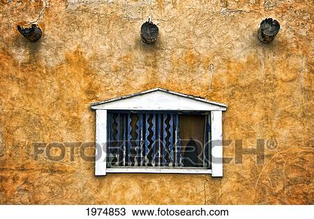 Stock Image - Windows Ii, New Mexico, Single Window On Adobe Wall.. Fotosearch
