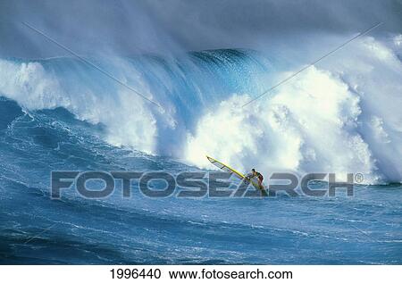 Stock Image - Windsurfer In Big Pounding Wave With Whitewash. Fotosearch