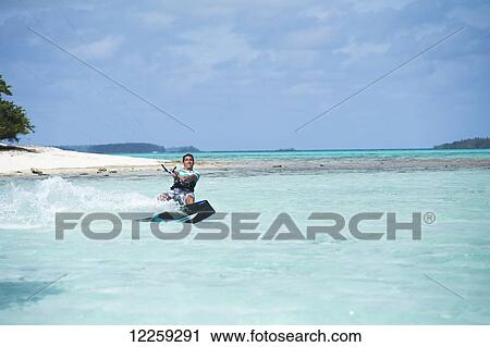 Stock Image - Windsurfing; Vavau, Tonga. Fotosearch