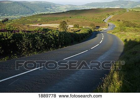 Windy Country Road Disappearing Into The Distance View Large Photo Image Stock Photo - Windy Country Road Disappearing Into The Distance. Fotosearch